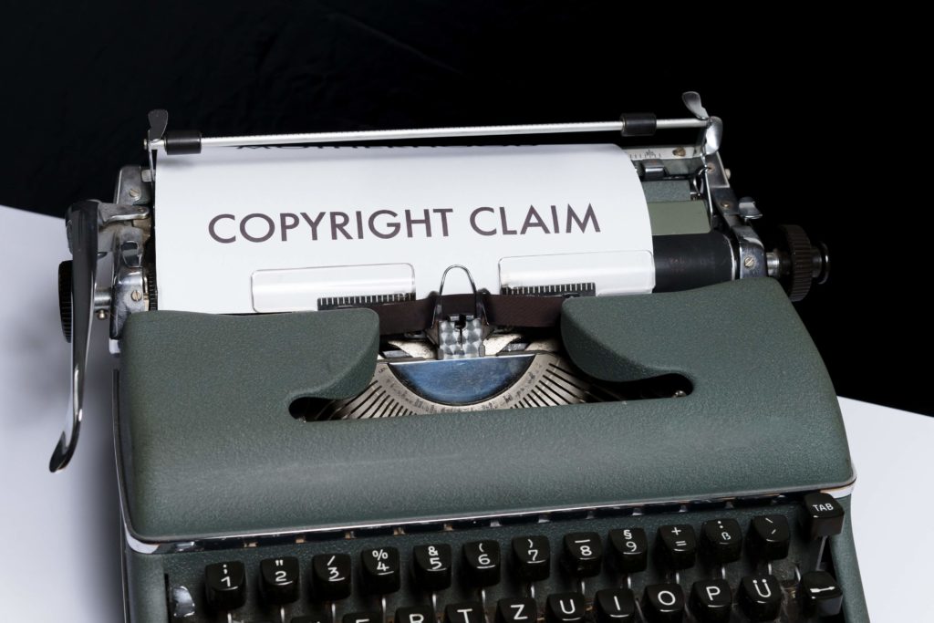 Copyright Claim in typewriter. YouTubers have been written up for unlawfully or unknowingly using copyrighted music in their videos.