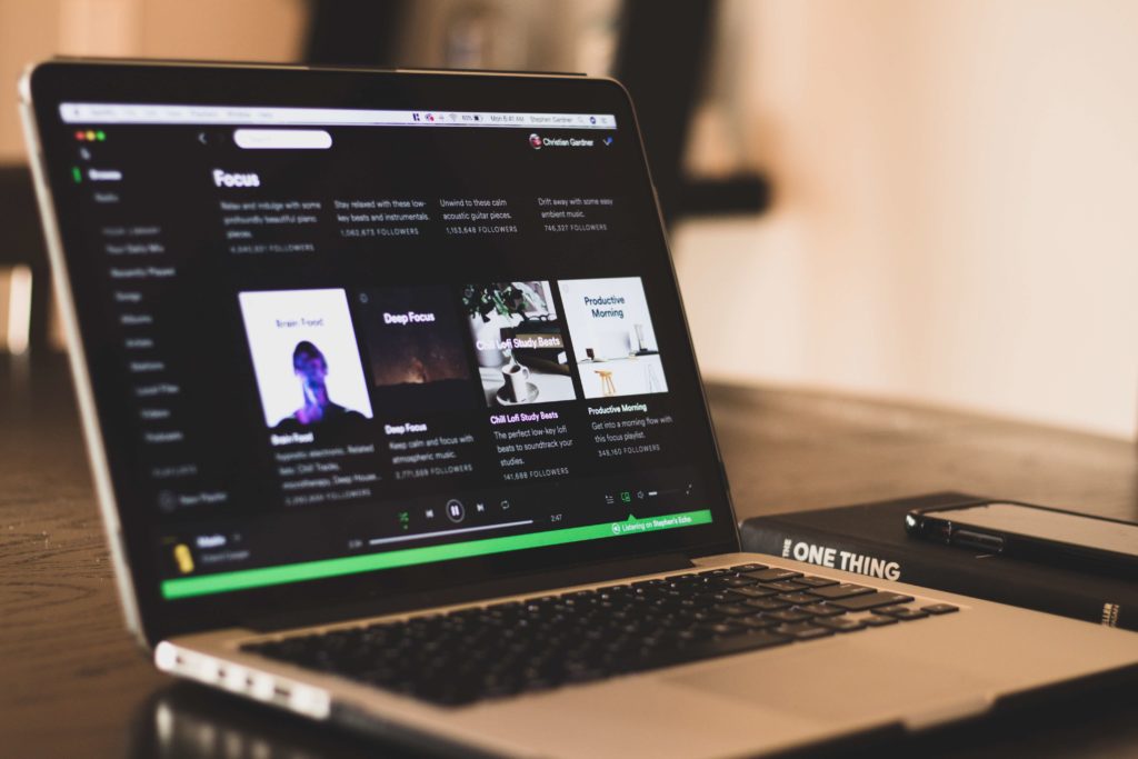 Spotify on a laptop. Submit songs for Spotify playlist consideration using a laptop